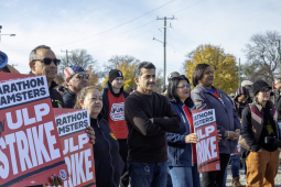 Striking workers and supporters hold signs that say Marathon Teamsters on ULP strike at a rally.