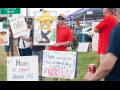 Frito-Lay workers hold signs on the picket line.