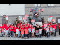 Dozens of Frontier workers / CWA members wearing red assembled with Scabby the inflatable rat