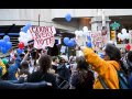 Crowd with many "count every vote" signs and balloons