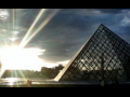 The Louvre's outside pyramid at sunset.