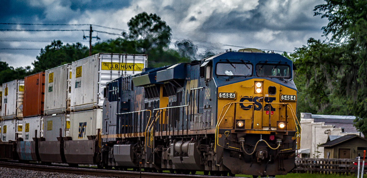 A CSX train with JB Hunt containers heads towards the camera.