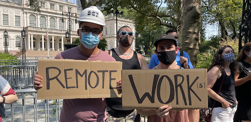 two protesters holding signs