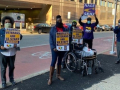 four protesters hold signs: "PROTECT VETERANS AND VA STAFF #VACOVID" AND "NAGE SEIU"