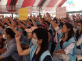 Taiwanese flight staff assembled in protest with arms raised.