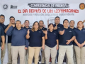 St Gobain workers stand in front of a large banner reading: Press Conference—The Day After Contract Legitimations; Advances and Challenges in Independent Unionism