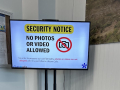 A screen at an Ultium Cells facility which says, "Security Notice: No Photos or Videos Allowed."