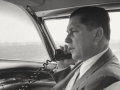 The late Teamsters president Jimmy Hoffa talking on the phone in a car.