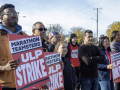 Striking workers and supporters hold signs that say Marathon Teamsters on ULP strike at a rally.