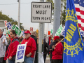 UAW strikers picketing on a street corner.