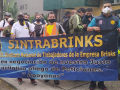 Sintrabrinks workers picketing behind a blue banner in Cali, Colombia in December 2020.