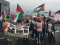 Block the Boat NY/NJ protesters with Palestinian flags at the port near Elizabeth, NJ.